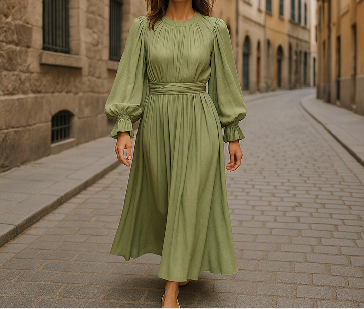 Modest sage green pleated midi dress with balloon sleeves and waist tie, ideal for formal events or stylish everyday wear