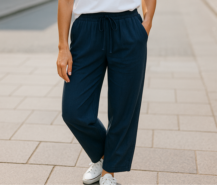 Woman wearing navy cotton jogger pants with drawstring waist, casual modest style, one size fits S to XL
