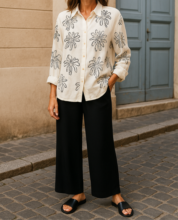 Beige floral embroidered button-up shirt paired with black wide-leg pants – elegant and modest outfit for everyday or casual outings