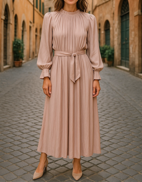 Modest long-sleeve pleated dress in nude beige with waist tie, ideal for everyday wear or special occasions like Eid or weddings.