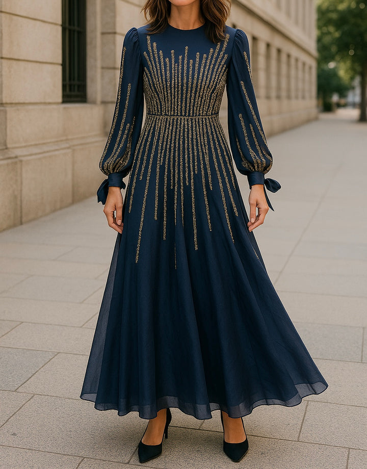Modest navy blue maxi dress with golden vertical embroidery and puff sleeves tied at the cuffs, ideal for formal occasions and hijabi women