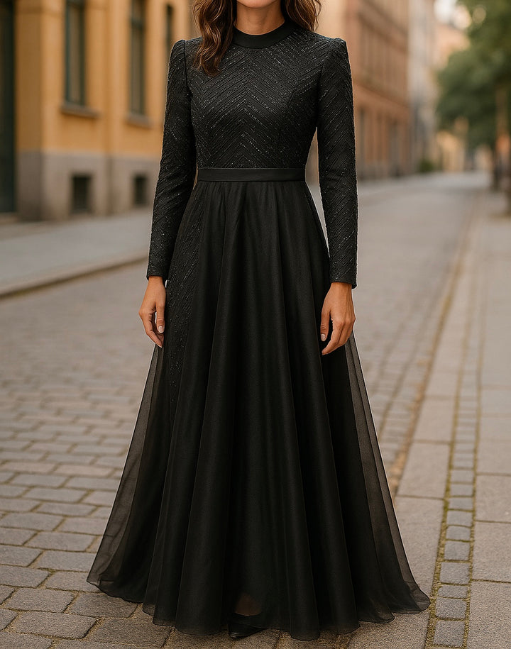 Modest black full-length evening gown with long sleeves, textured bodice, and flowing A-line skirt, perfect for formal occasions