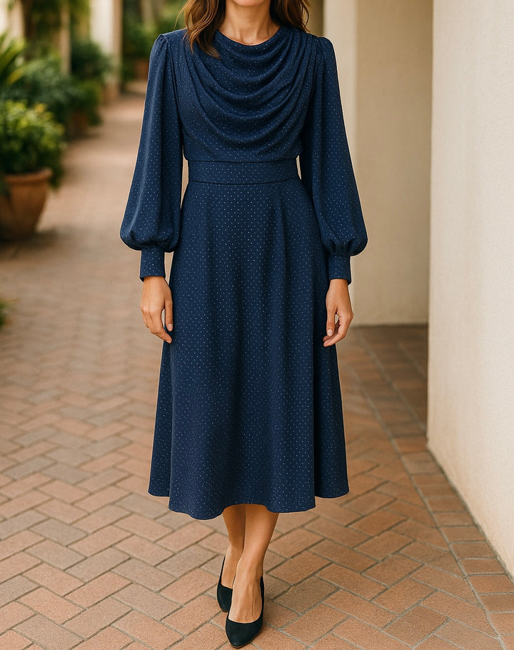 Navy blue modest midi dress with draped neckline, polka dot pattern, and long puff sleeves, ideal for hijabi women