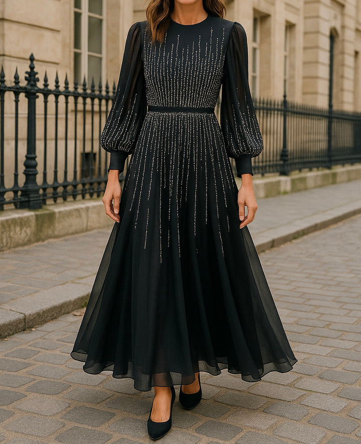 Elegant black chiffon evening dress with long puff sleeves and silver vertical embroidery, modest and flowing for hijabi women